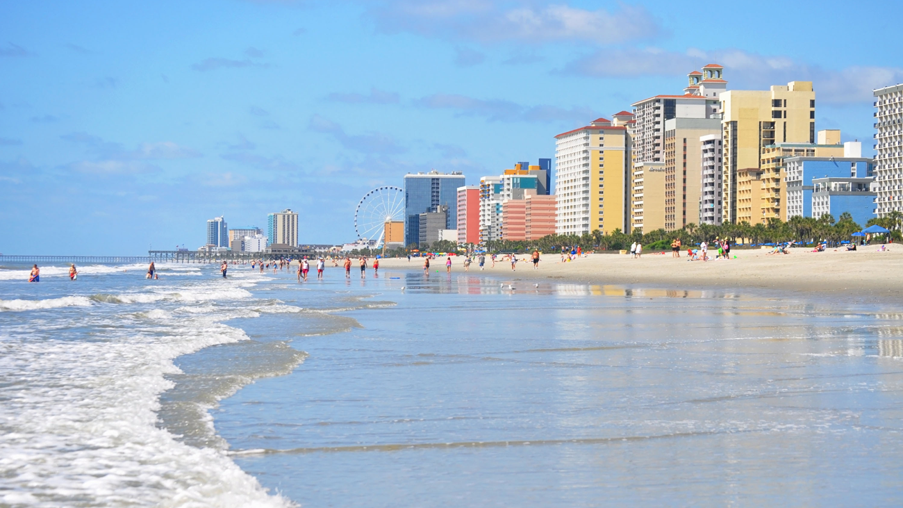 View of the beach with a strip of hotels and amusement park in distance at Myrtle Beach, a Marriott Vacation Club destination