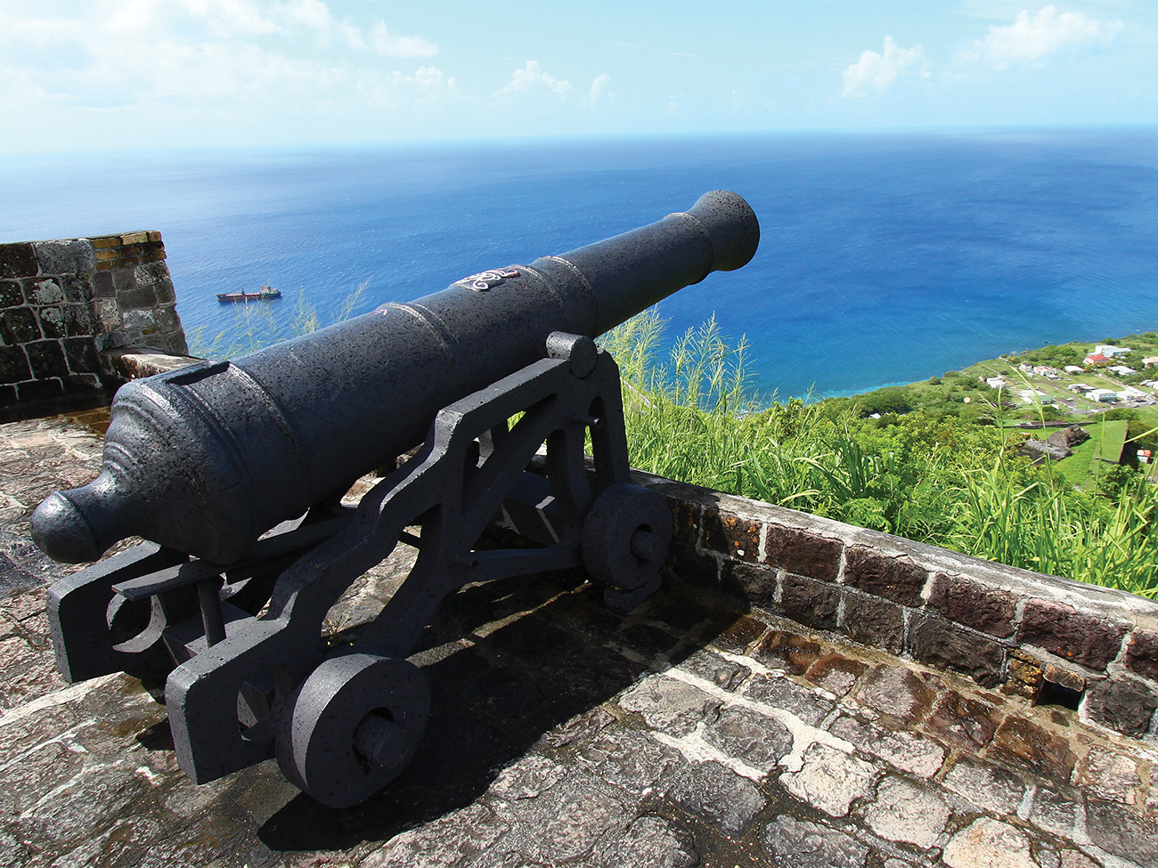 Canon looking out over a wall at Brimstone Hill Fortress, Saint Kitts, a Marriott Vacation Club timeshare destination