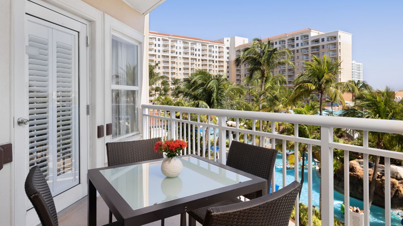ac-one-or-two-bedroom-villa-garden-primary-bedroom-balcony-interior-photo