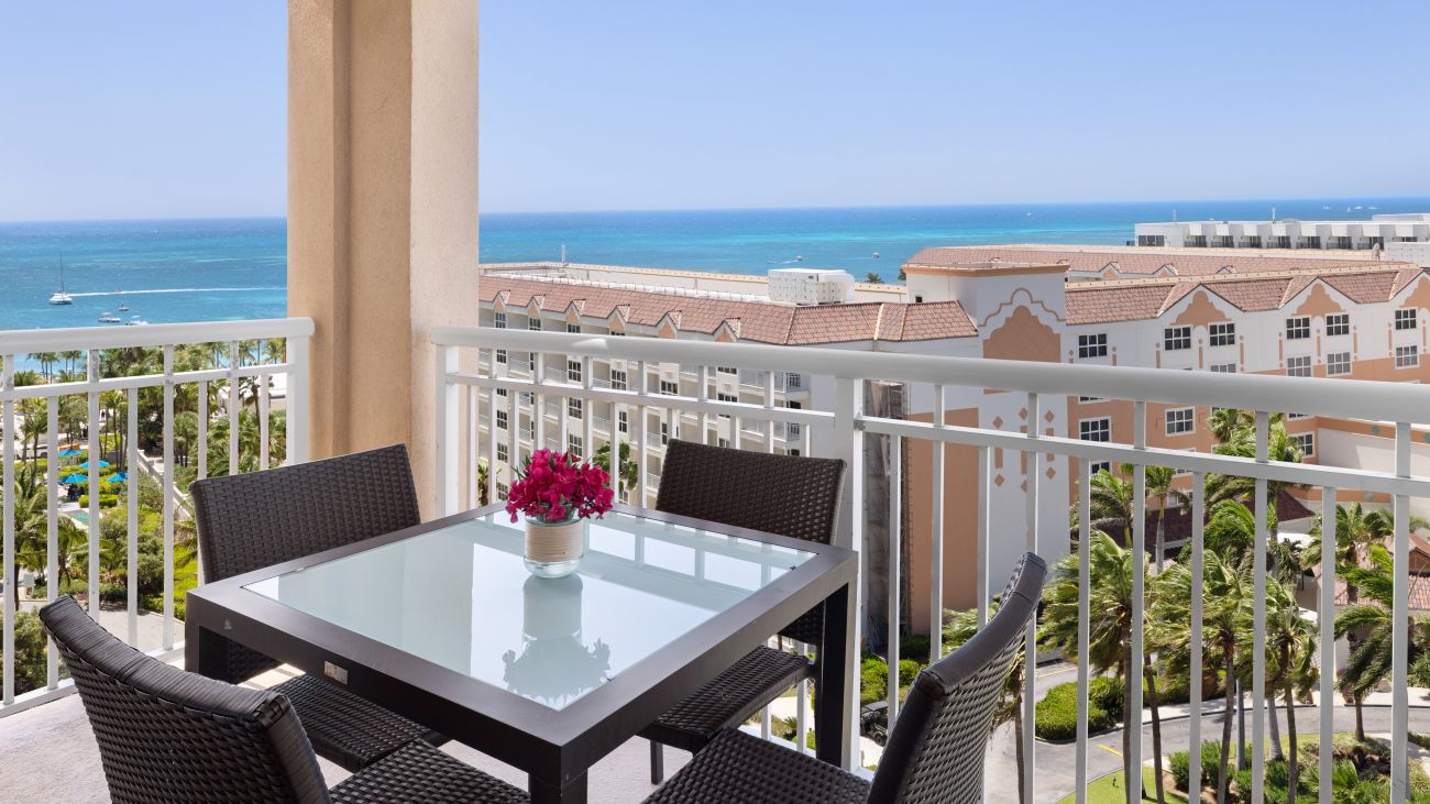 ac-one-or-two-bedroom-villa-ocean-primary-bedroom-balcony-interior-photo