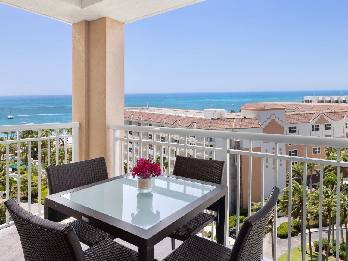 ac-one-or-two-bedroom-villa-ocean-primary-bedroom-balcony-interior-photo