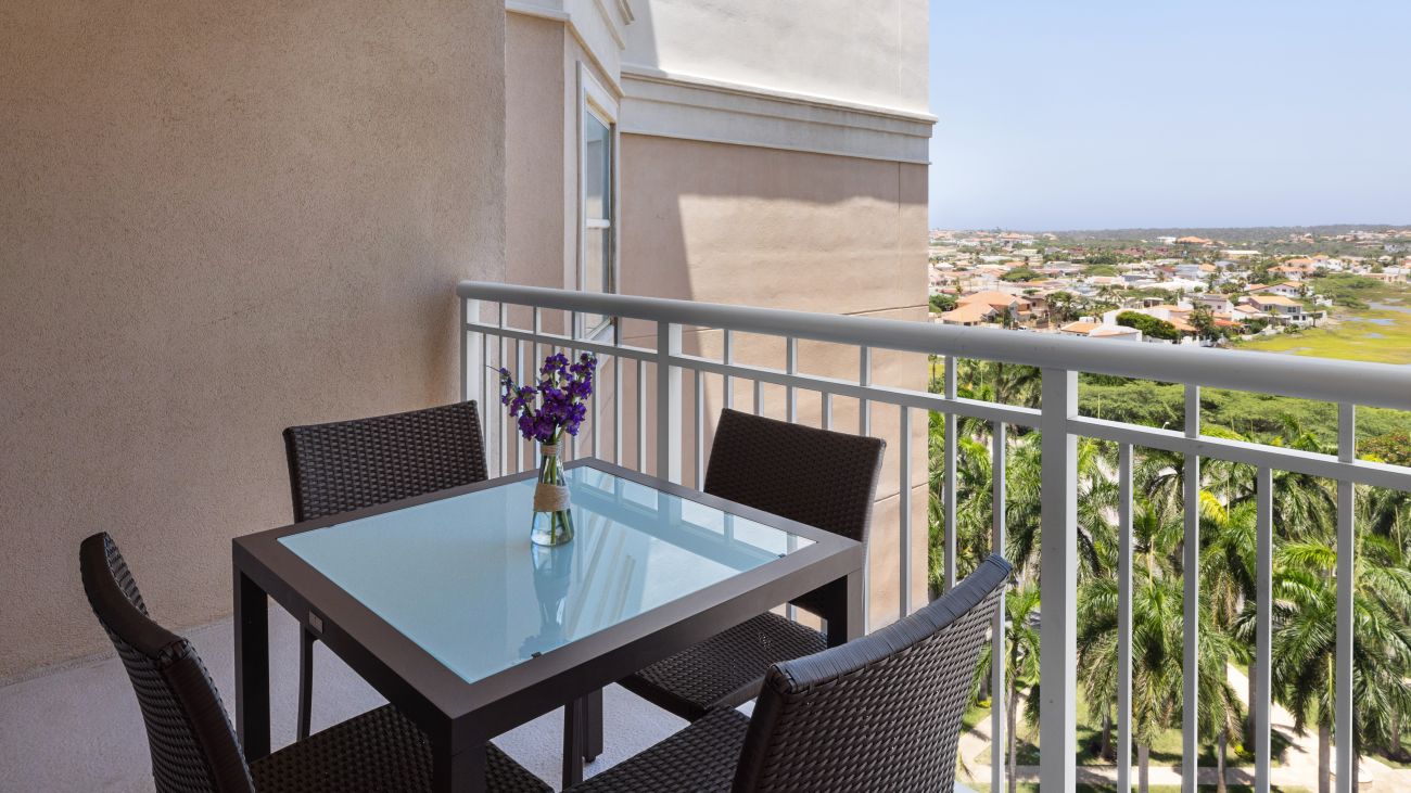 ac-three-bedroom-villa-primary-bed-balcony-interior-photo