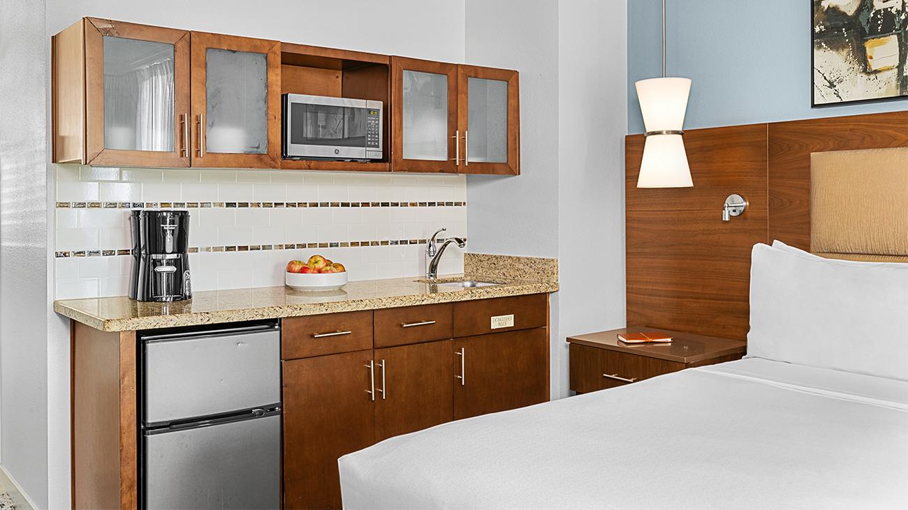 ds-two-bedroom-and-guestroom-kitchenette-and-bed-interior-photo