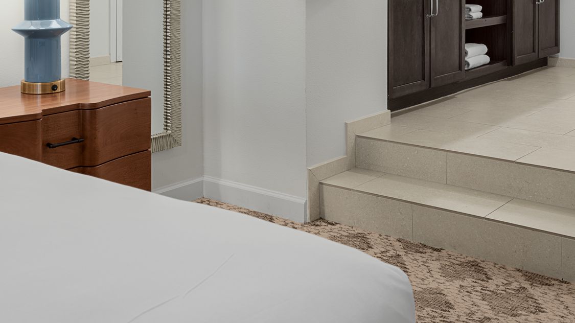 sa-two-bedroom-villa-bedroom-to-bathroom-stairs-interior-photo