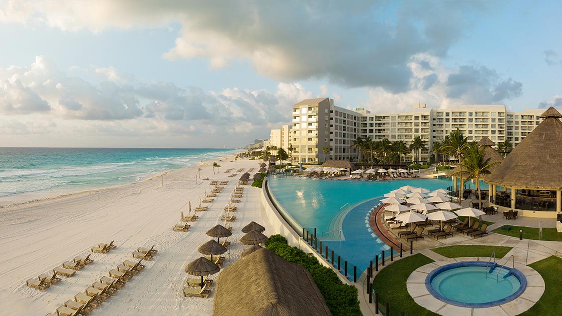 Aerial view of beach, pool and tiki bar at the Westin Lagunamar resort timeshare in Mexico