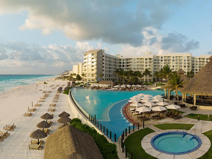 Aerial view of beach, pool and tiki bar at the Westin Lagunamar resort timeshare in Mexico