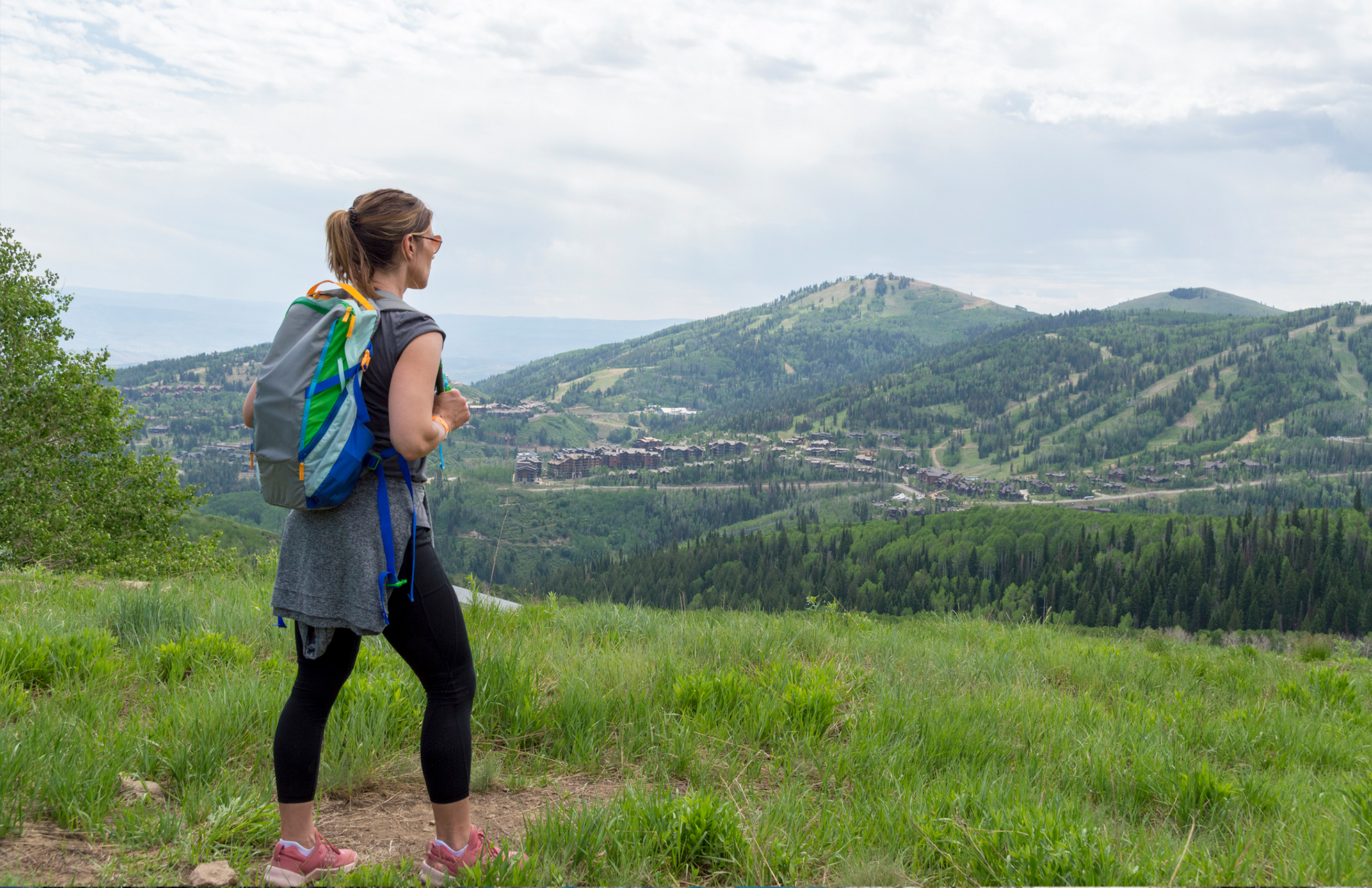Hiking on top of a hill looking at the Mountains around Park City, Utah