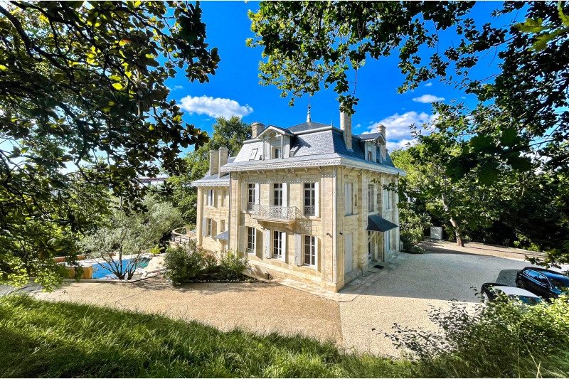 A golden home with a pool stands out from the countryside