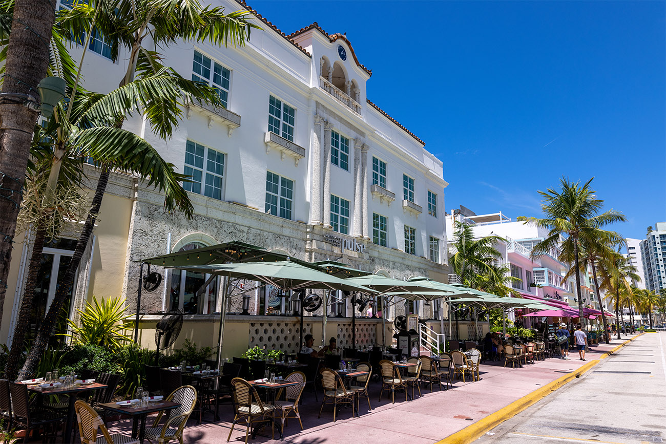 Covered dining tables line the street in front of the Marriott Vacation Club®, South Beach.