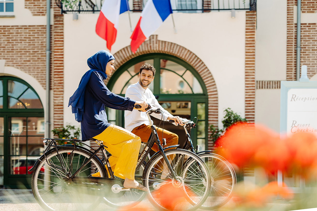 A couple biking in France