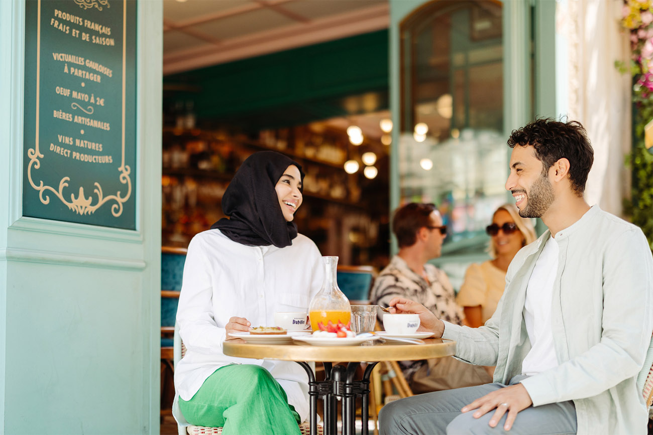 A couple dining at a French café