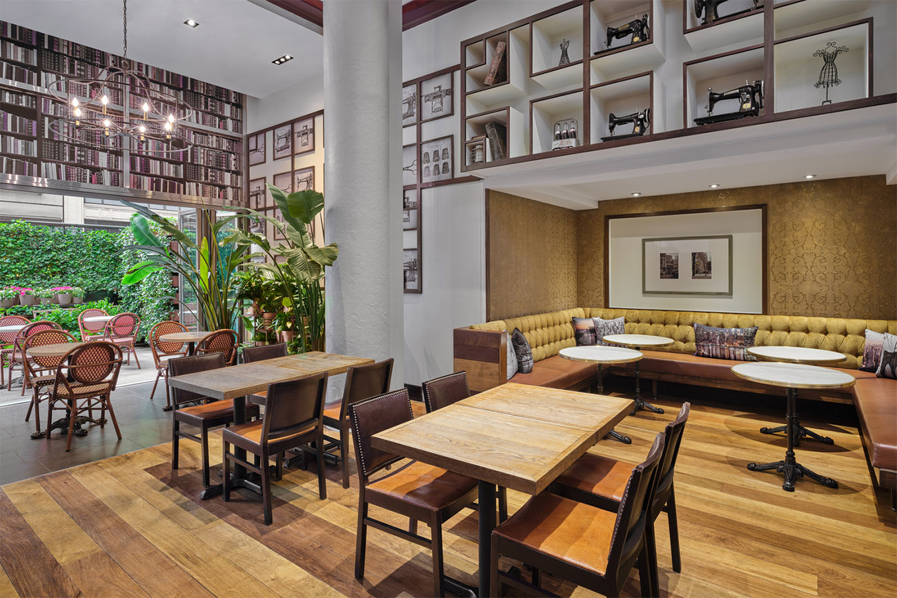 Twisted Knot Cafe featuring books and sewing machines themed to the Garment District