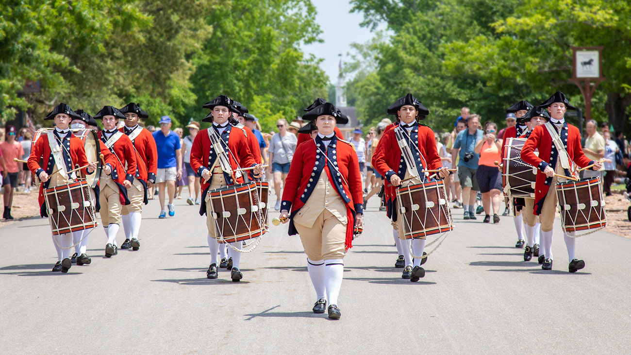 Colonial reenactors marching in a Fourth of July parade