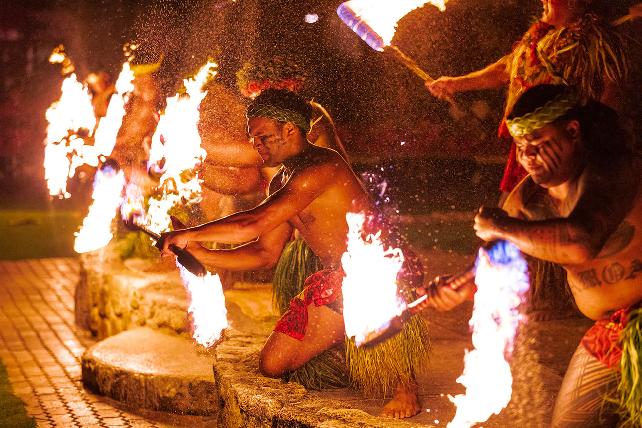 Bright fire illuminates traditional dancers in Hawaii.