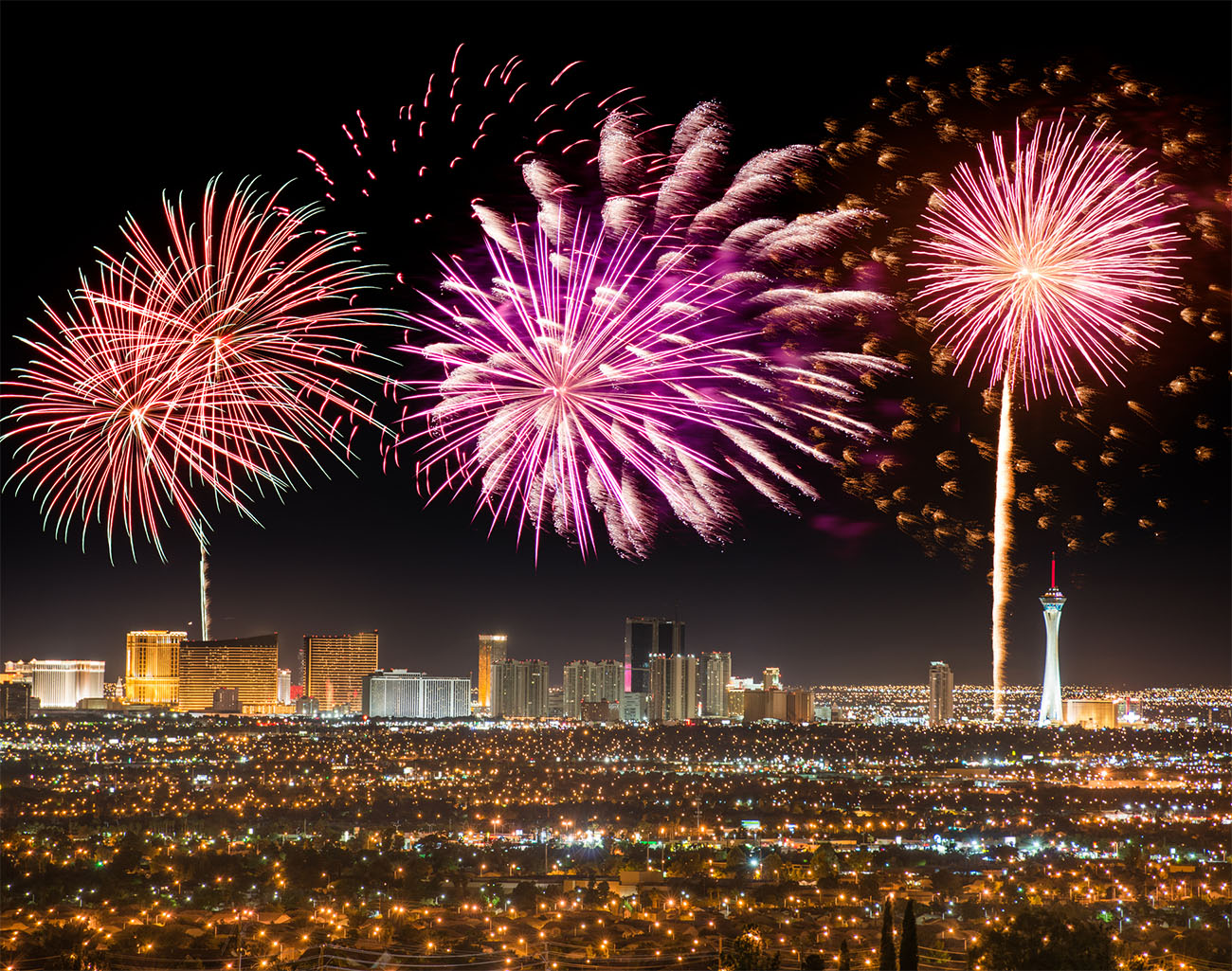 Colorful fireworks erupt above the Las Vegas Strip