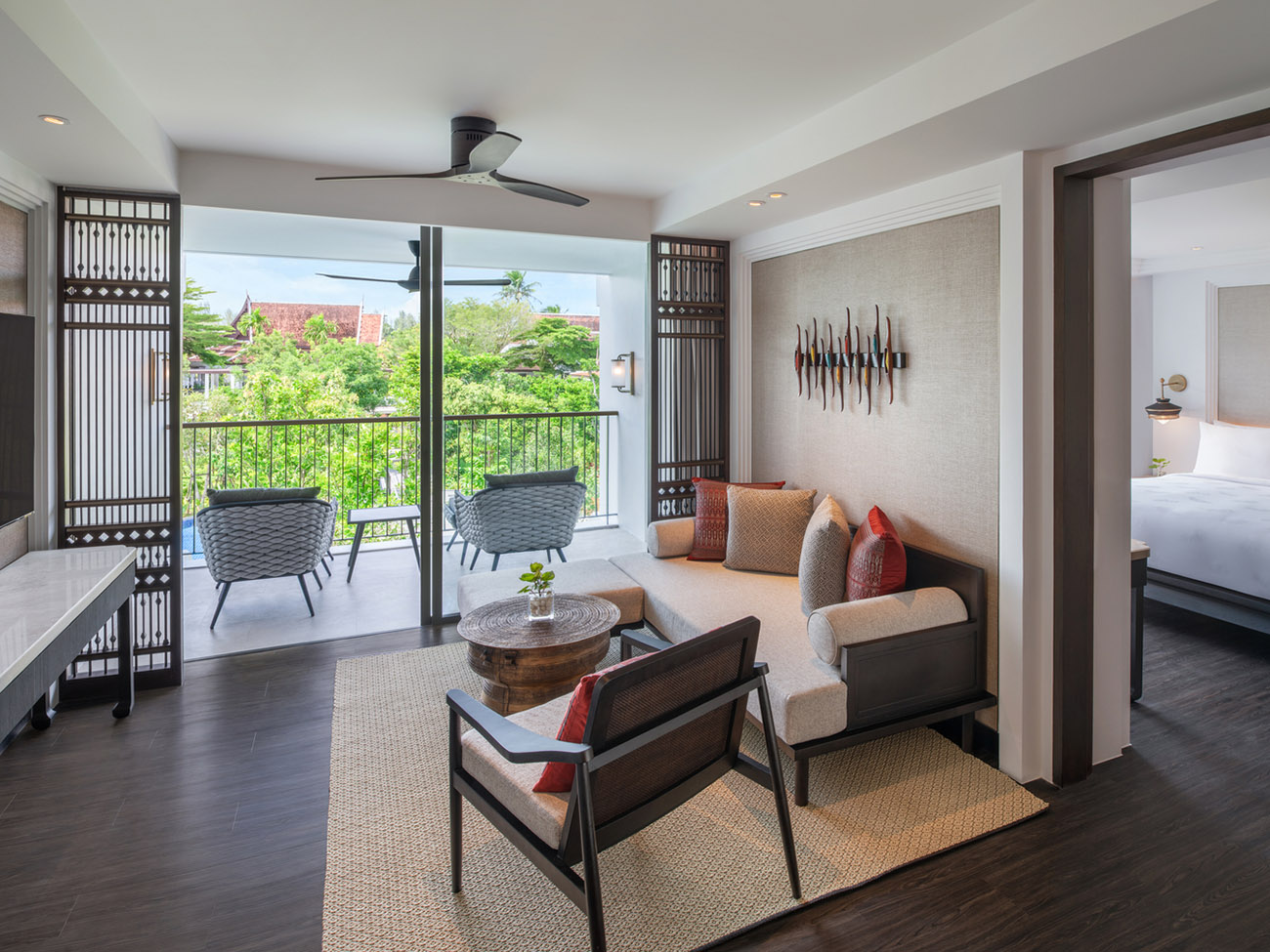 A living room in front of a sliding glass door. 