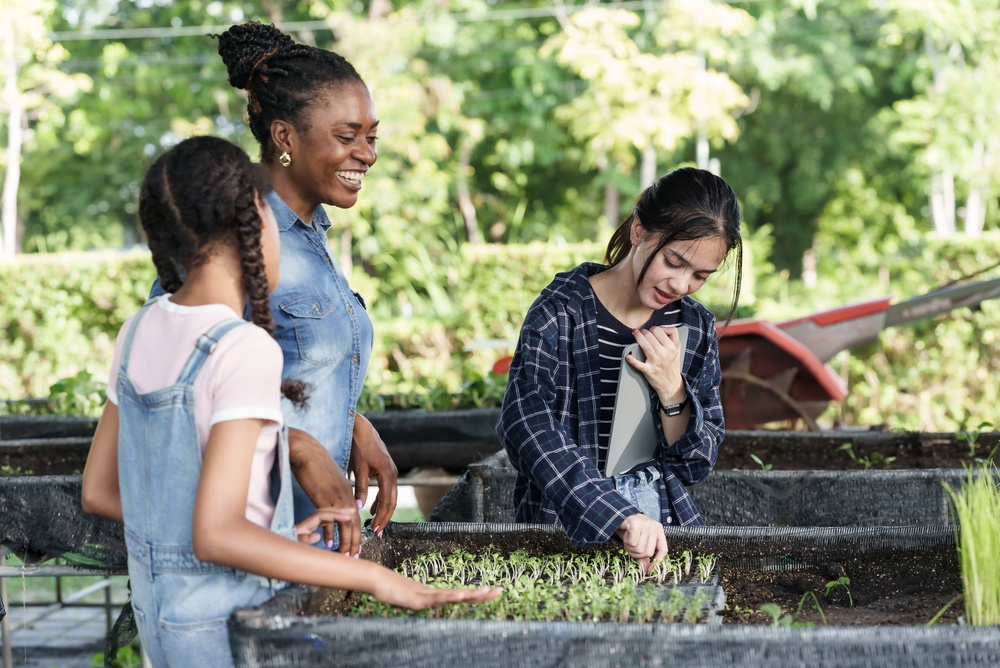 Visitors explore a farm education area.