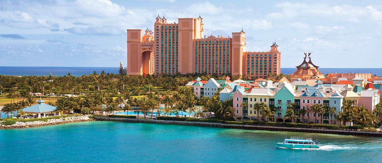 Aerial of exterior of Harborside Resort at Atlantis in The Bahamas, with ocean in the background